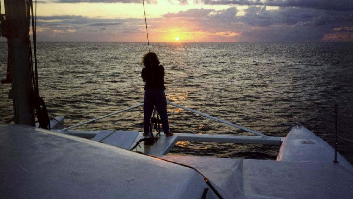 Tokyo Express catamaran at anchor — hull visible on calm water